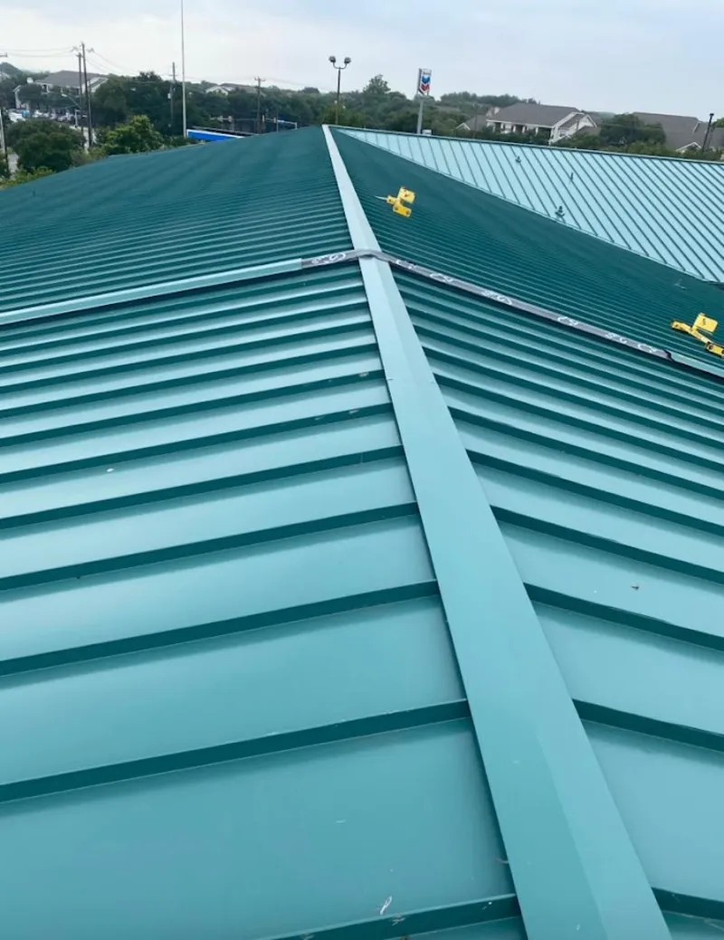 Green commercial metal roof ridge and valley for Metal Roof Repair in Buena Vista